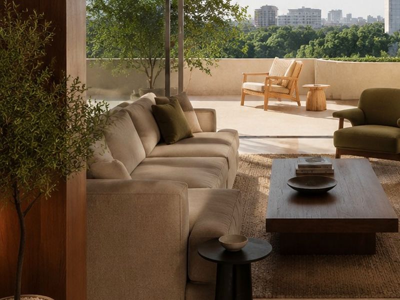 Lounge corner: Deep sofas, timber and soft linen.